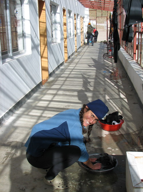Kerri doing laundry once we finished the walk around Mt. Kailash. Darchen, Tibet.